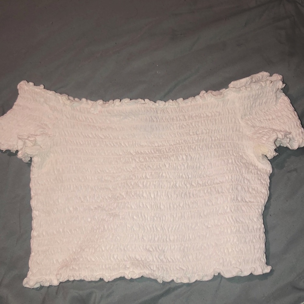 White off the shoulders crop top and is thick material, worn once.